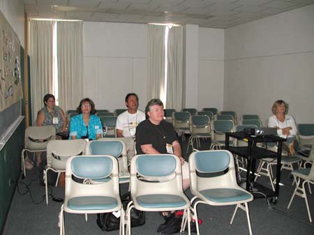 Tami Rivera, Barb Rizzo, Troy Otsuka, Sharon Thorp, and Peggy Kenyon take in a preconference session on simulations
